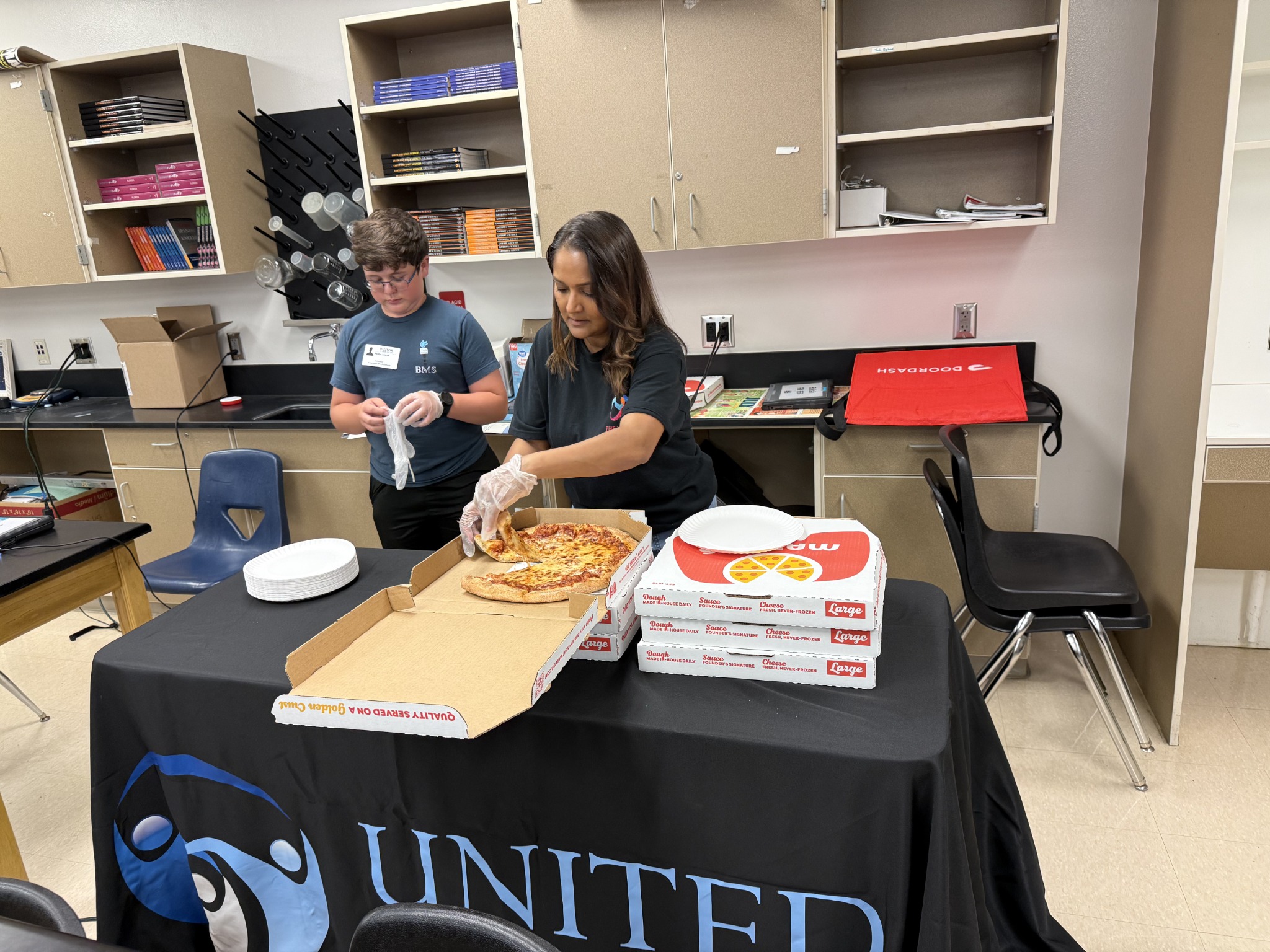 Students and staff preparing a shared food activity at Bridgewater