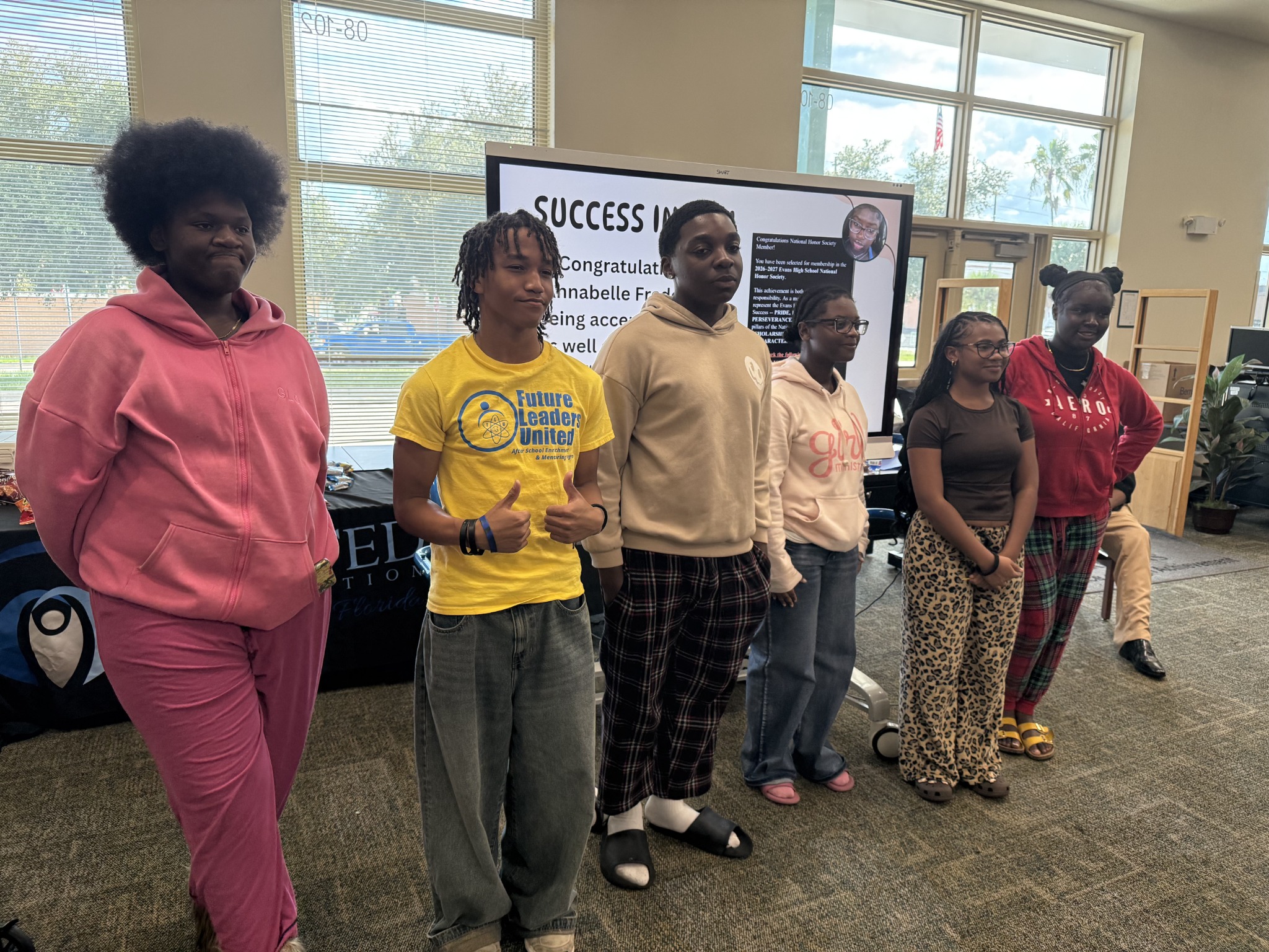Students and community partners standing together