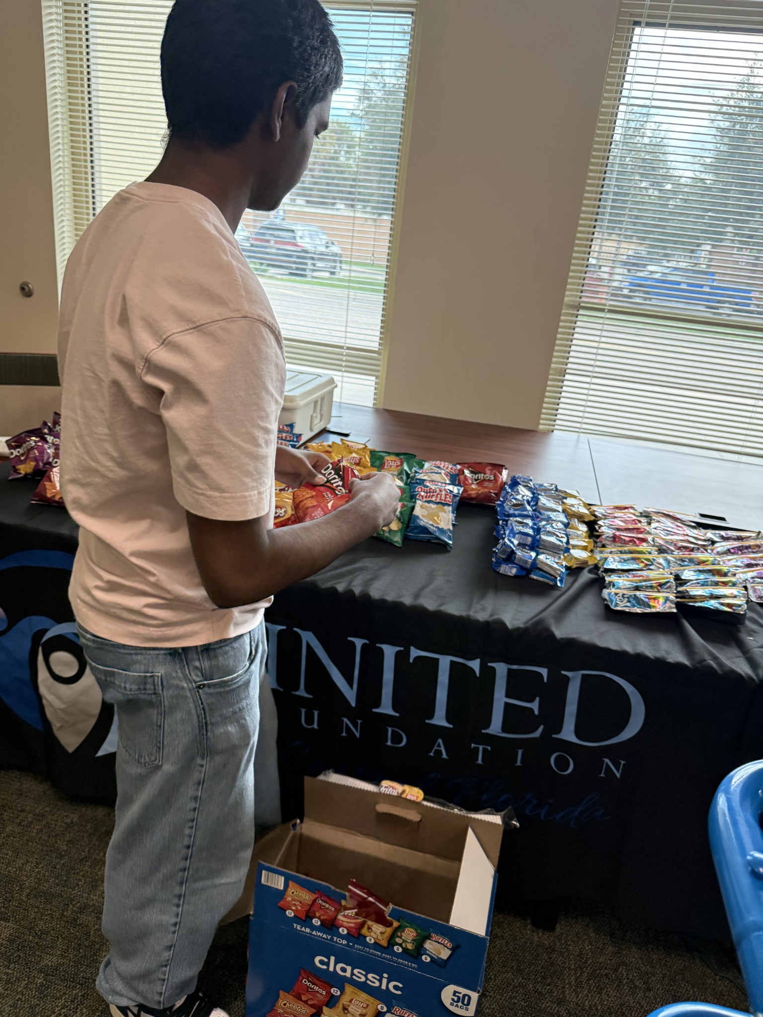 A program information table at a community gathering